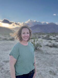 Photo of Samantha Young in desert at sunset