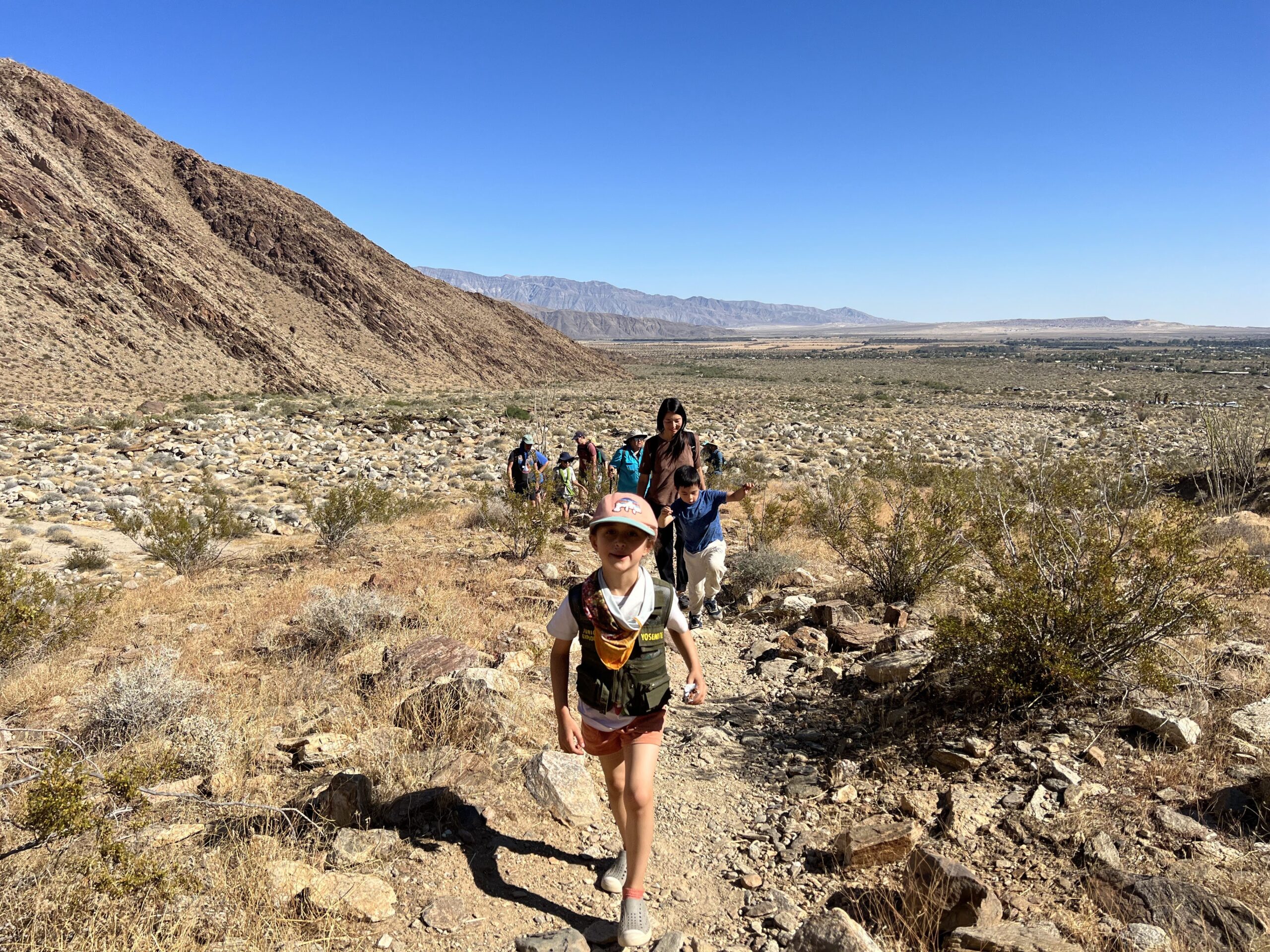 girl leading a class hike in the desert